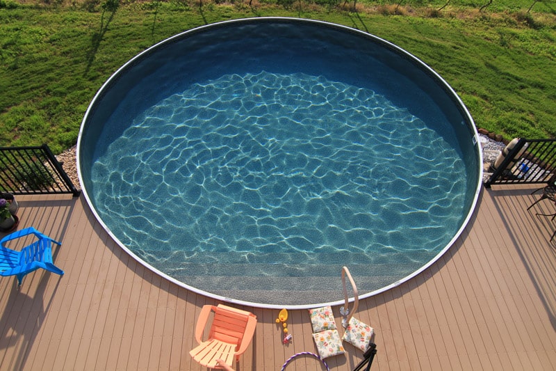wooden round above ground pool with walk-in stair