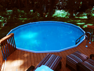 wooden round swimming pool with ladder and deck