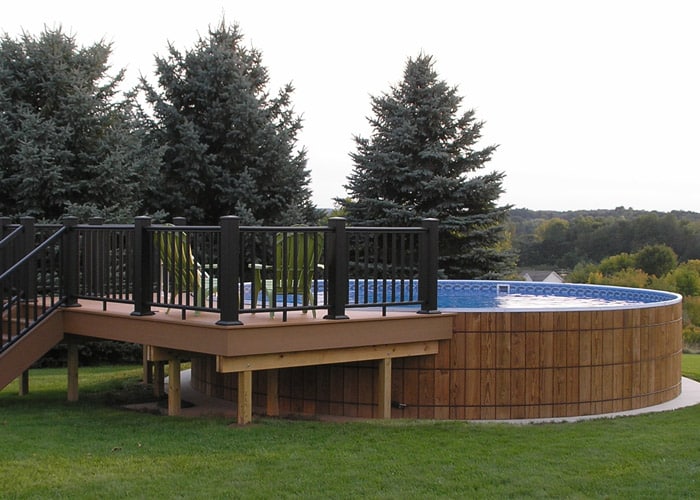 wooden round above ground pool with deck