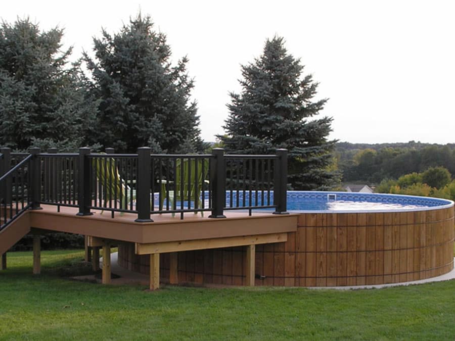 wooden round above ground pool with deck