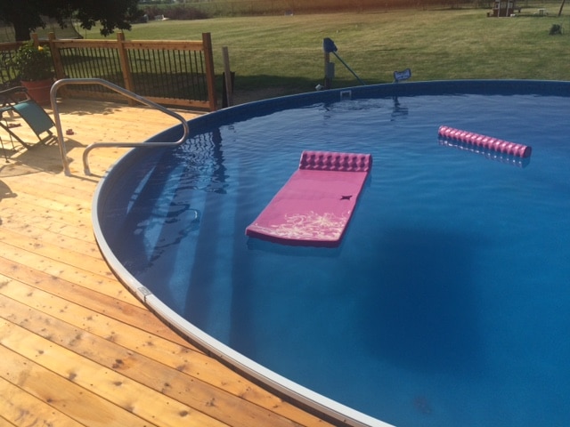 photo of a wooden pool with flotation devices